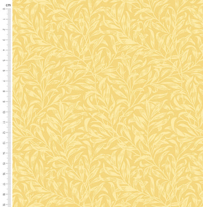 Pastel yellow willow bough design printed on quilting fabric with a cm ruler