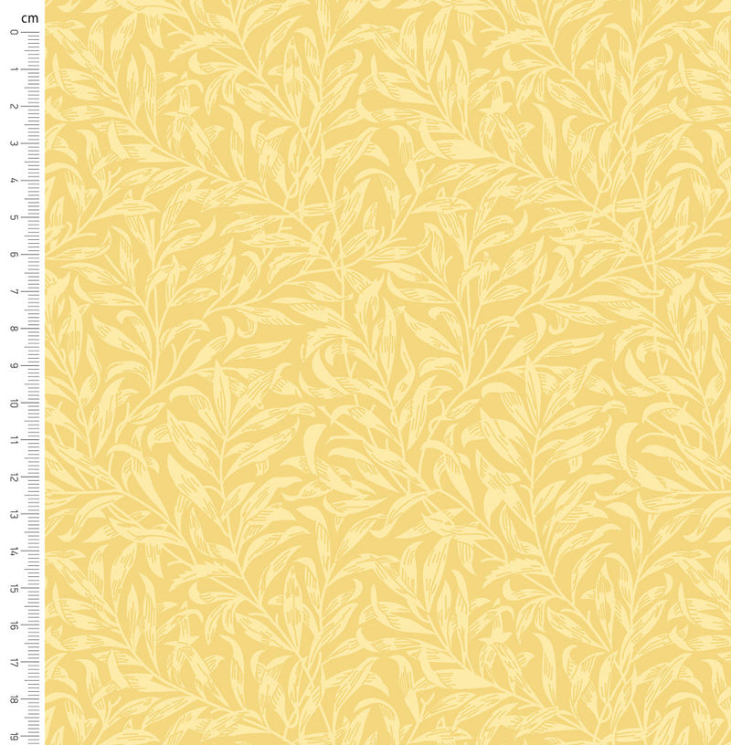Pastel yellow willow bough design printed on quilting fabric with a cm ruler