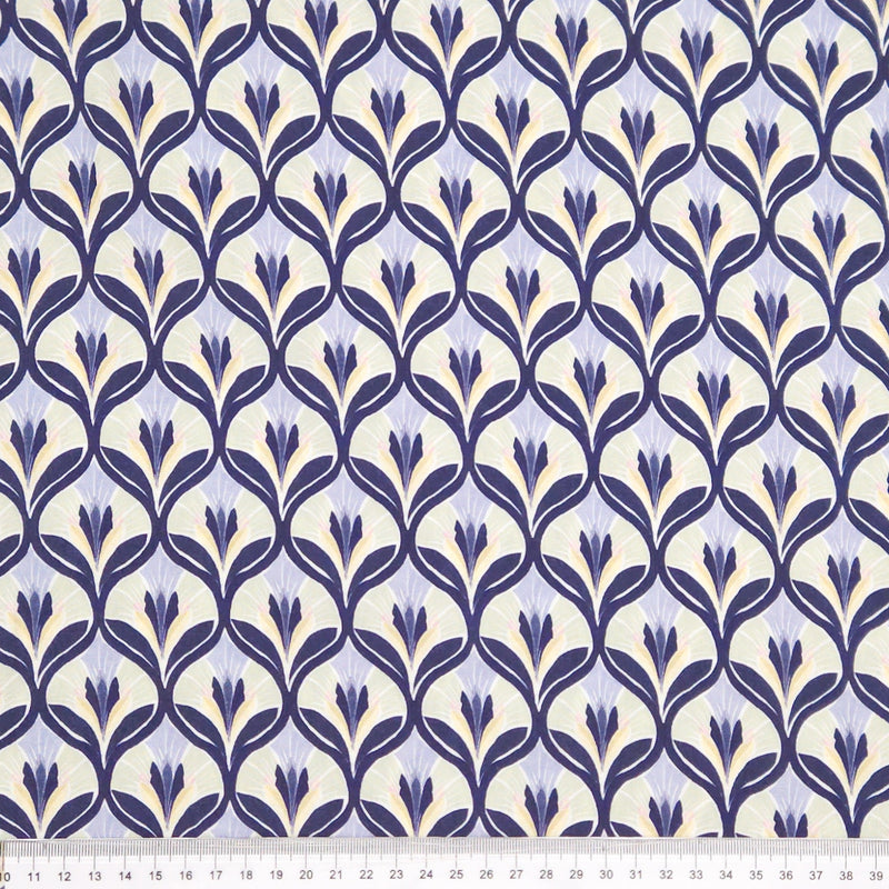 Patterned fabric with blue floral design on a light viscose fabric with a ruler
