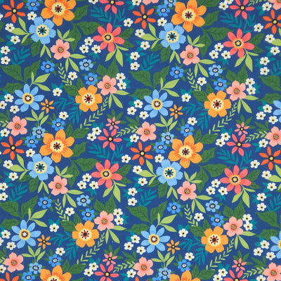 Colorful floral pattern on a blue polycotton fabric