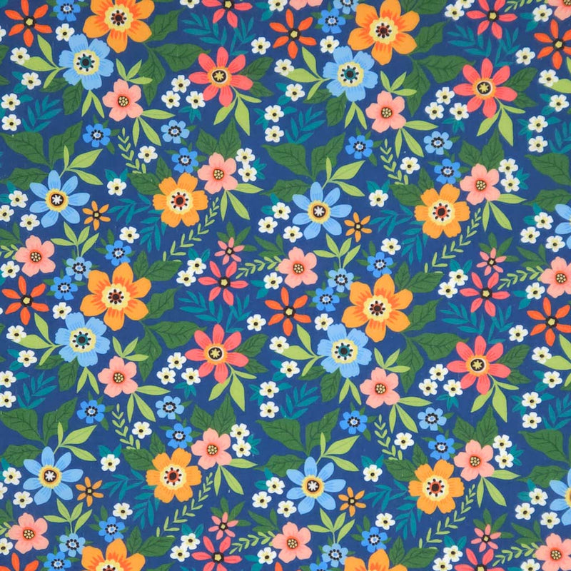 Colorful floral pattern on a blue polycotton fabric