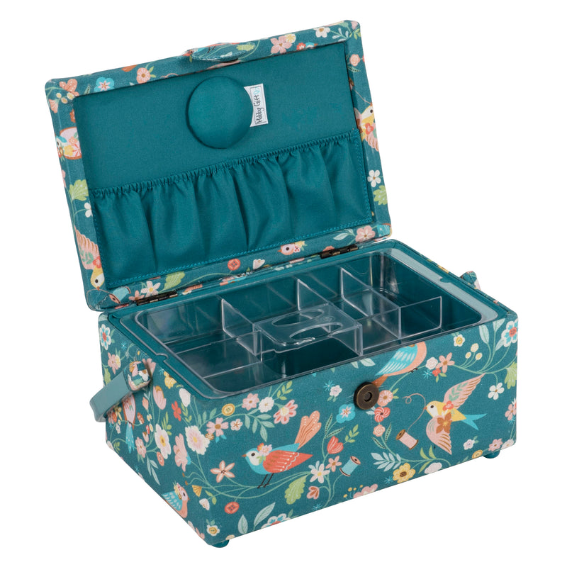 An open sewing box in teal aviary