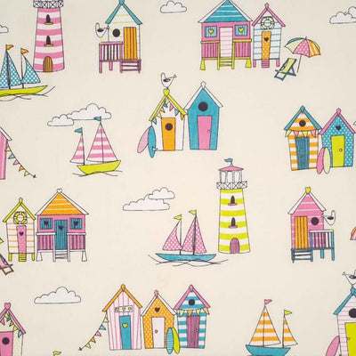 Colourful beach huts in a gorgeous tutti frutti colourway are printed on an ivory, 100% cotton fabric.