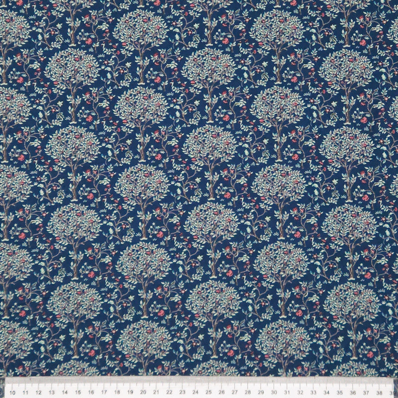 Floral patterned pima cotton lawn fabric with a ruler at the bottom for scale.