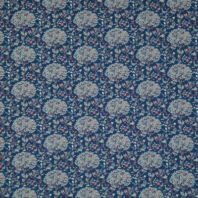 Pattern of trees with flowers on a dark blue pima cotton lawn fabric