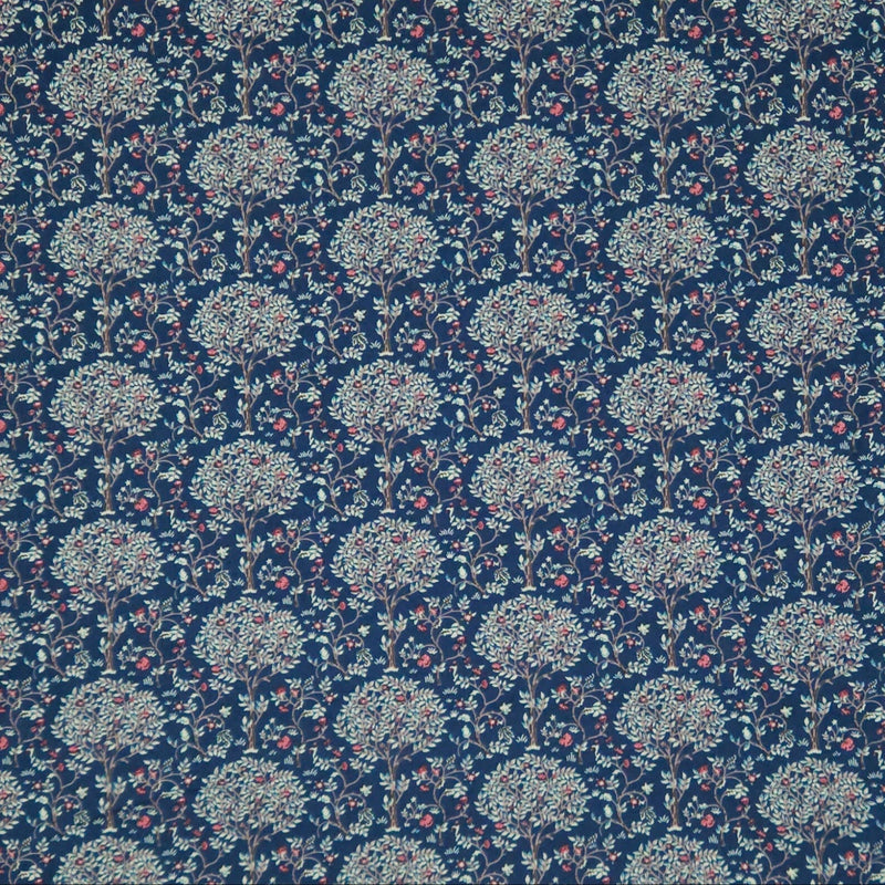 Pattern of trees with flowers on a dark blue pima cotton lawn fabric