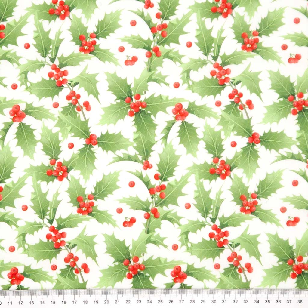 Pattern of green holly leaves and red berries on a white background with a ruler at the bottom.