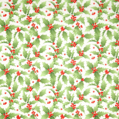 Pattern of green holly leaves and red berries on a white background
