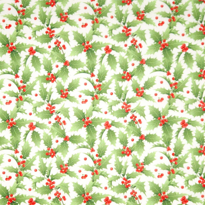 Pattern of green holly leaves and red berries on a white background