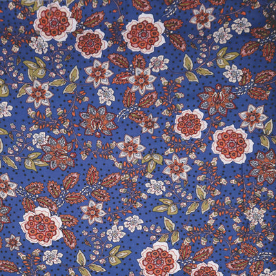 Floral pattern with red, white, and green flowers on a blue viscose fabric