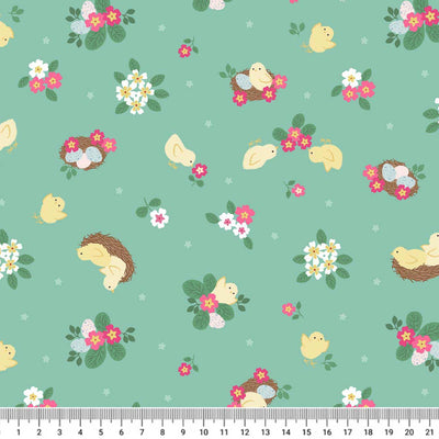 Cute little Easter chicks in nests are printed on a spring green 100% premium quilting cotton with a cm ruler