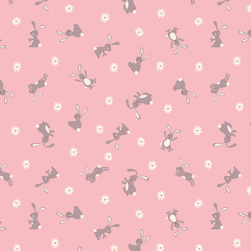 Cute little Easter bunnies are printed on a pink 100% premium quilting cotton