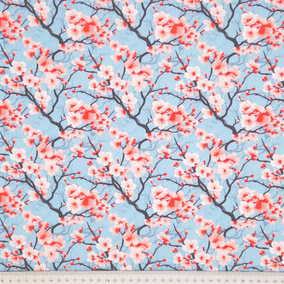 Cherry blossom pattern on a blue background with a cm ruler