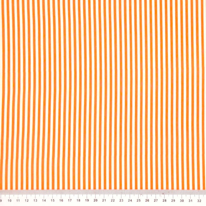 Orange candy stripes printed on a white cotton fabric with a cm ruler