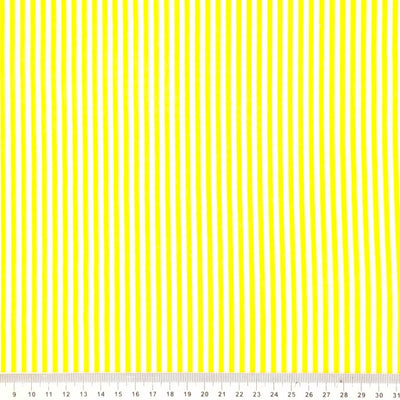 Sunshine yellow and white candy stripes on a cotton fabric with a cm ruler