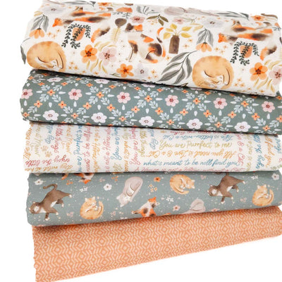 A fat quarter bundle of five cat and flower themed quilting fabrics