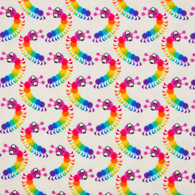 Brightly coloured caterpillars printed on an ivory cotton jersey fabric