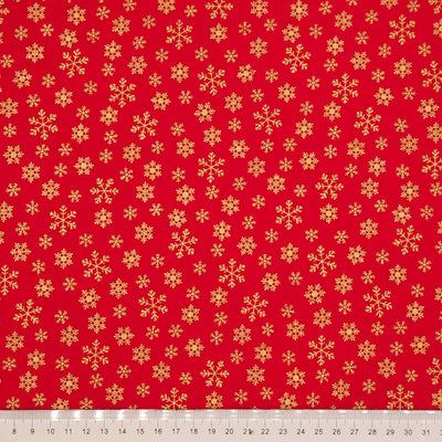 Red fabric with gold snowflake pattern
