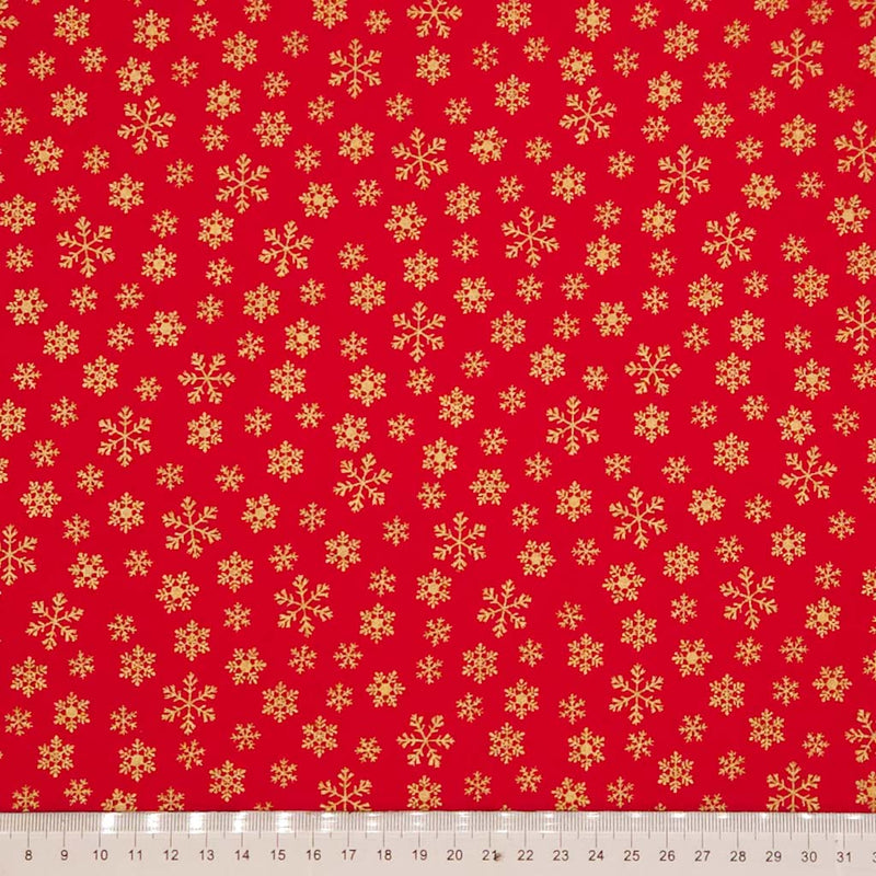 Red fabric with gold snowflake pattern
