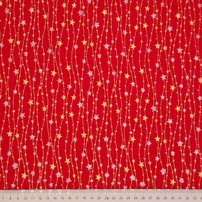 Red fabric with star and line pattern on a red background