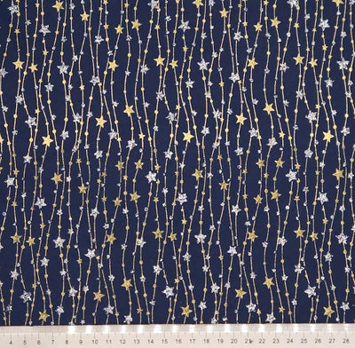 Navy blue fabric with gold and silver star pattern