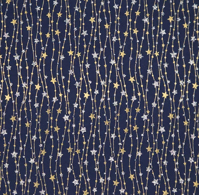 Pattern of stars and string lights on a dark blue cotton fabric