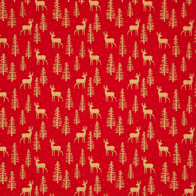 Pattern of deer and trees on a red cotton fabric