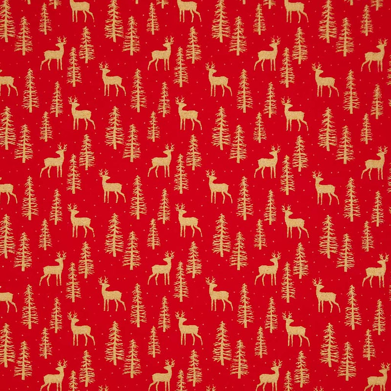 Pattern of deer and trees on a red cotton fabric