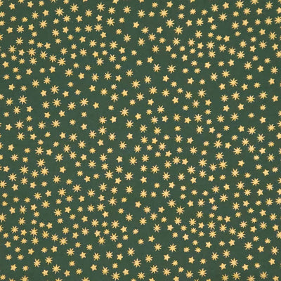 Pattern of small gold stars on a green cotton fabric