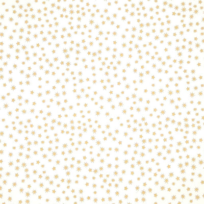 Pattern of small gold stars on a cream cotton fabric