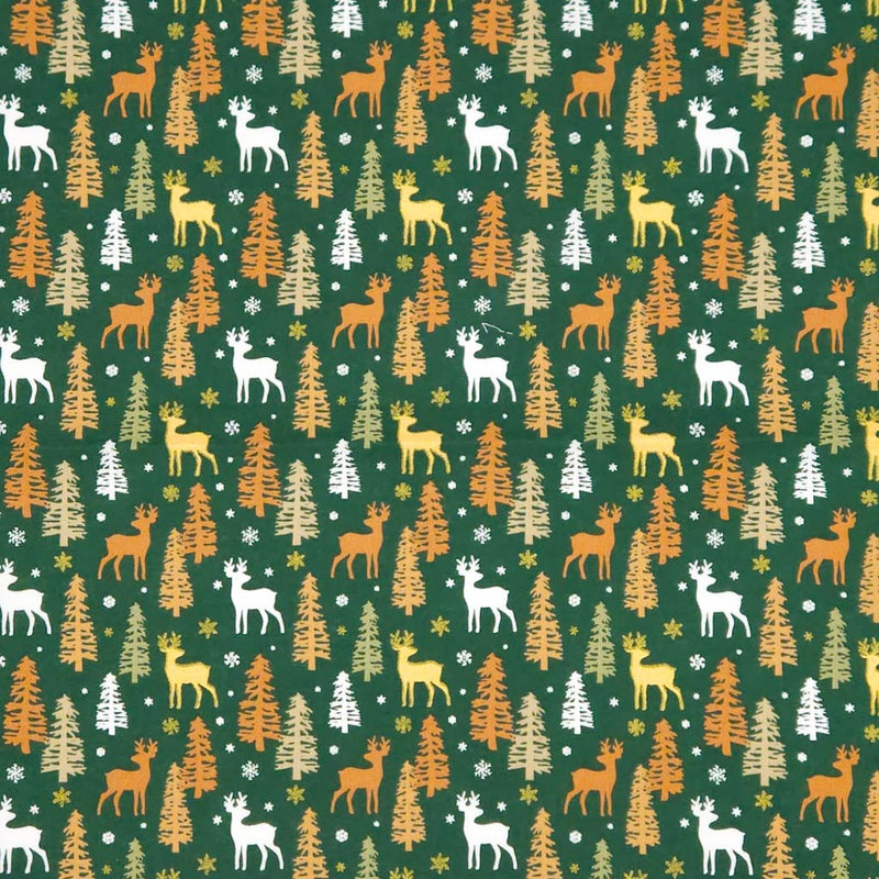 Pattern of deer and trees on a green christmas cotton fabric