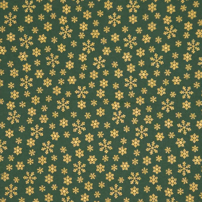 Pattern of gold snowflakes on a green cotton fabric