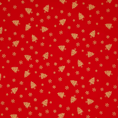 Red fabric with gold Christmas tree and snowflake pattern