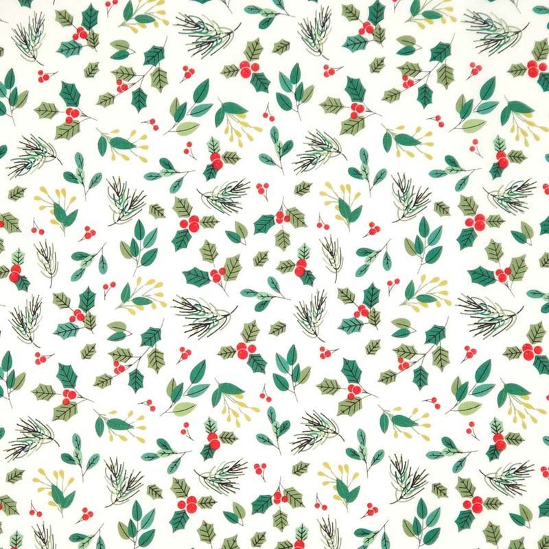 Pattern of Christmas foliage with green leaves, red berries, and pinecones on an ivory cotton fabric