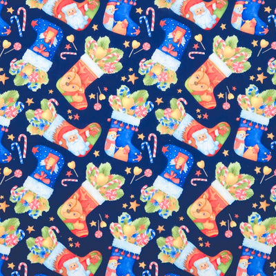 Christmas-themed fabric pattern with colorful stockings, Santa Claus, and candy canes on a dark blue background.