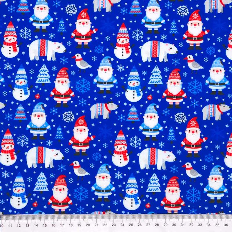 Pattern of Santa Claus, snowmen, and polar bears on a blue polycotton fabric with trees and birds.