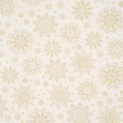 A stunningly intricate gold lacquered snowflake design printed on a cream 100% cotton fabric.