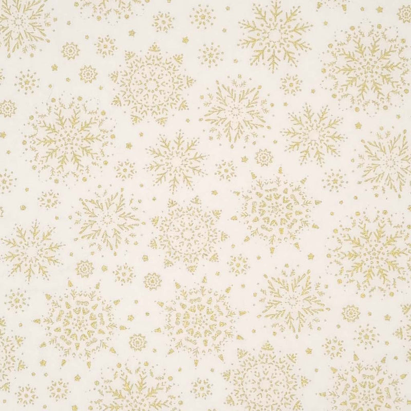 A stunningly intricate gold lacquered snowflake design printed on a cream 100% cotton fabric.