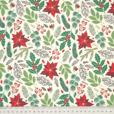 Poinsettia and mixed Christmas leaves such as fern, holly and berries are printed on an ivory 100% cotton fabric by Rose & Hubble with a cm ruler