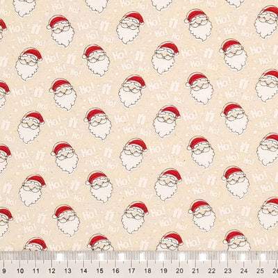 Jolly santa faces and his famous words 'ho ho ho' printed on a natural 100% cotton fabric with a cm ruler