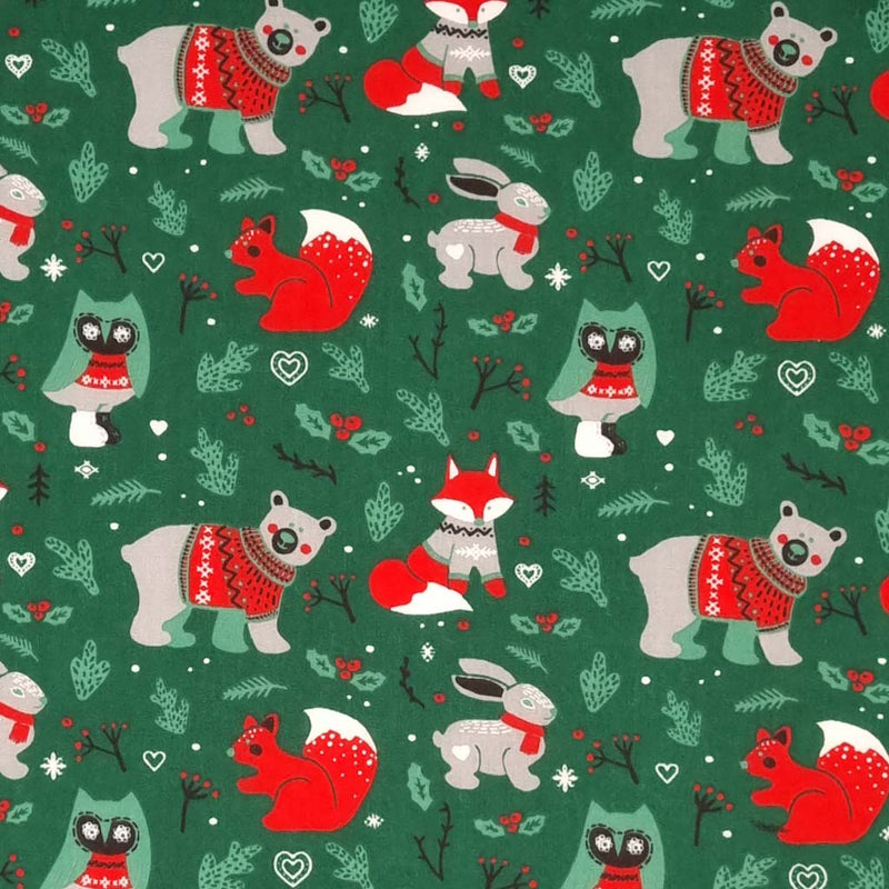 Woodland animals printed on a festive green polycotton fabric