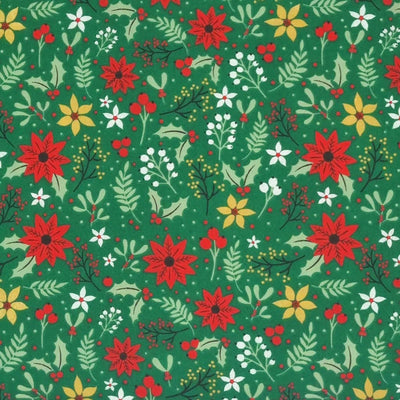 A christmas poinsettia fabric print on a green polycotton