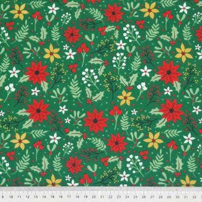 Christmas poinsettia printed on a green polycotton fabric
