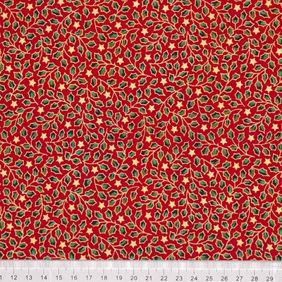 Green and gold mini holly leaves are printed on a red christmas cotton fabric