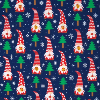 Christmas gonks with red hats and surrounded by snowflakes are printed on a navy polycotton fabric