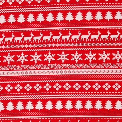 A white scandinavian style design printed on a red christmas polycotton fabric