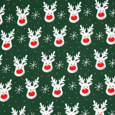 Smiling reindeer faces printed on a green polycotton fabric