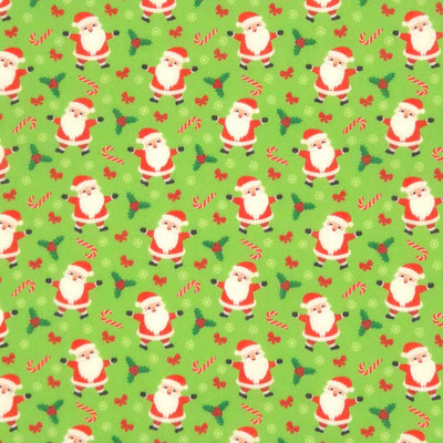 Santa and candy canes printed on a green polycotton fabric