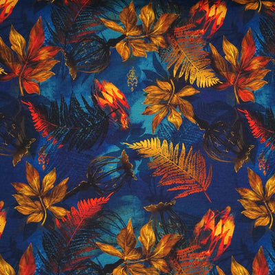 Golden and red leaves are printed on a navy blue viscose jersey fabric