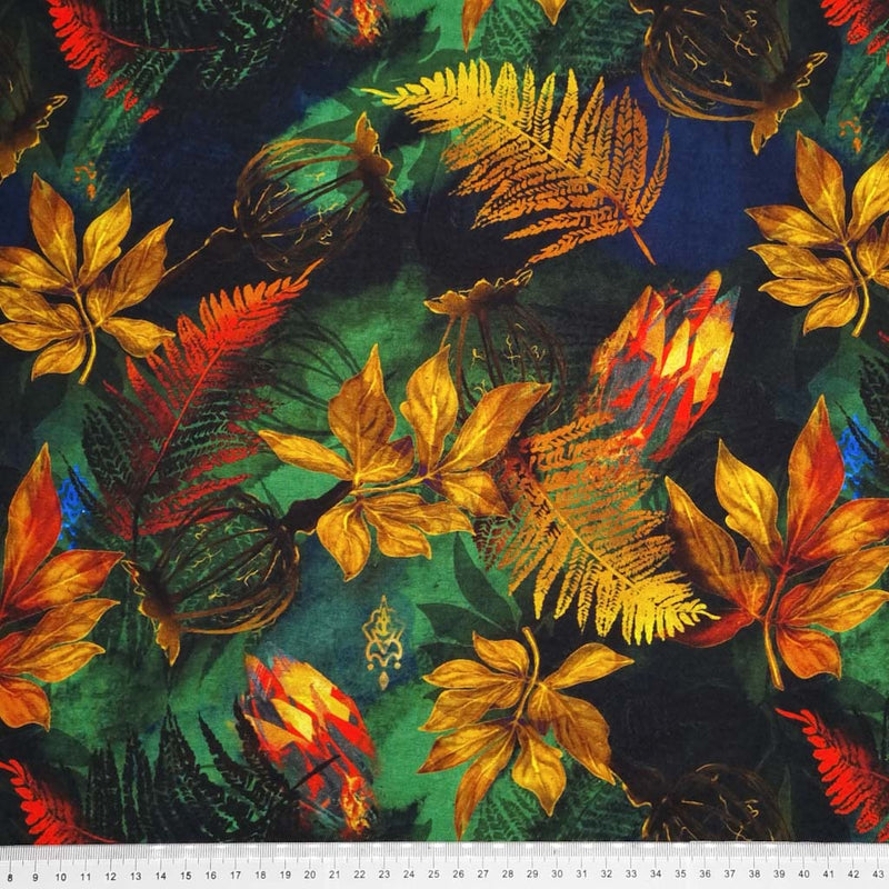 Golden autumnal leaves printed on a viscose jersey fabric with a cm ruler